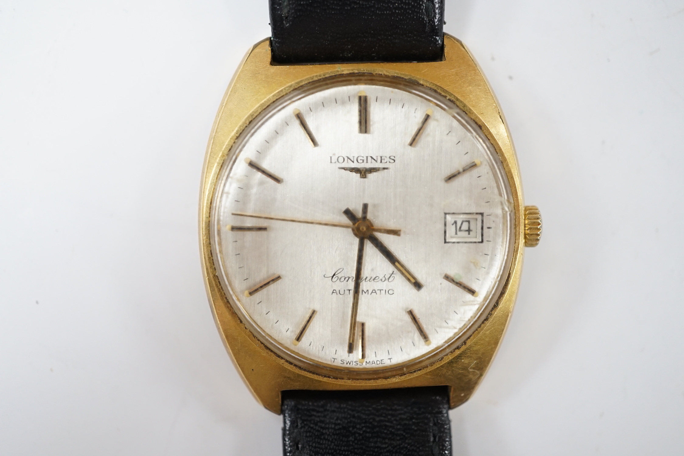 A gentleman's steel and gold plated Longines Conquest automatic wrist watch, with date aperture, on associated leather strap, case diameter 34mm.
